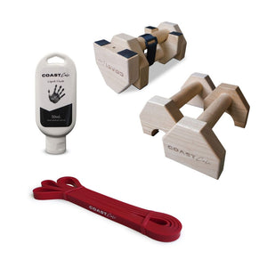 A collection of fitness equipment including a pair of wooden dumbbells, a resistance band, and a bottle of spray with the brand 'Coast' visible on it.