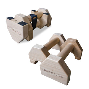 A pair of wooden travel parallettes on white background