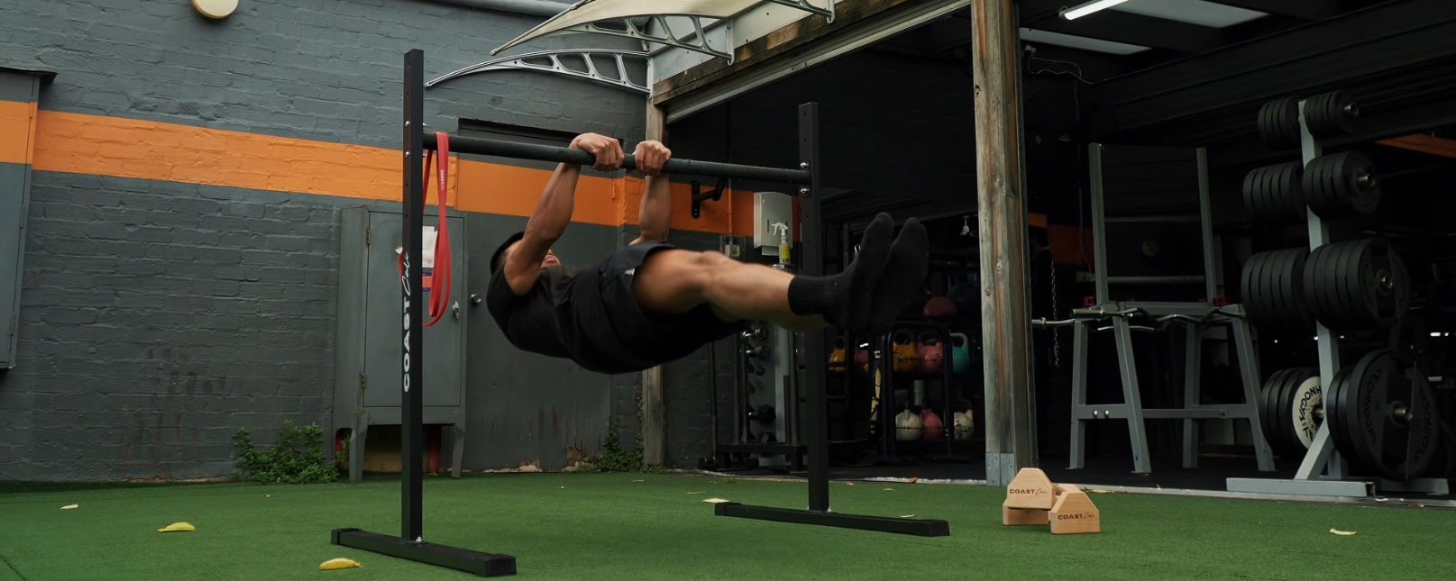 Man doing a front lever on static bar