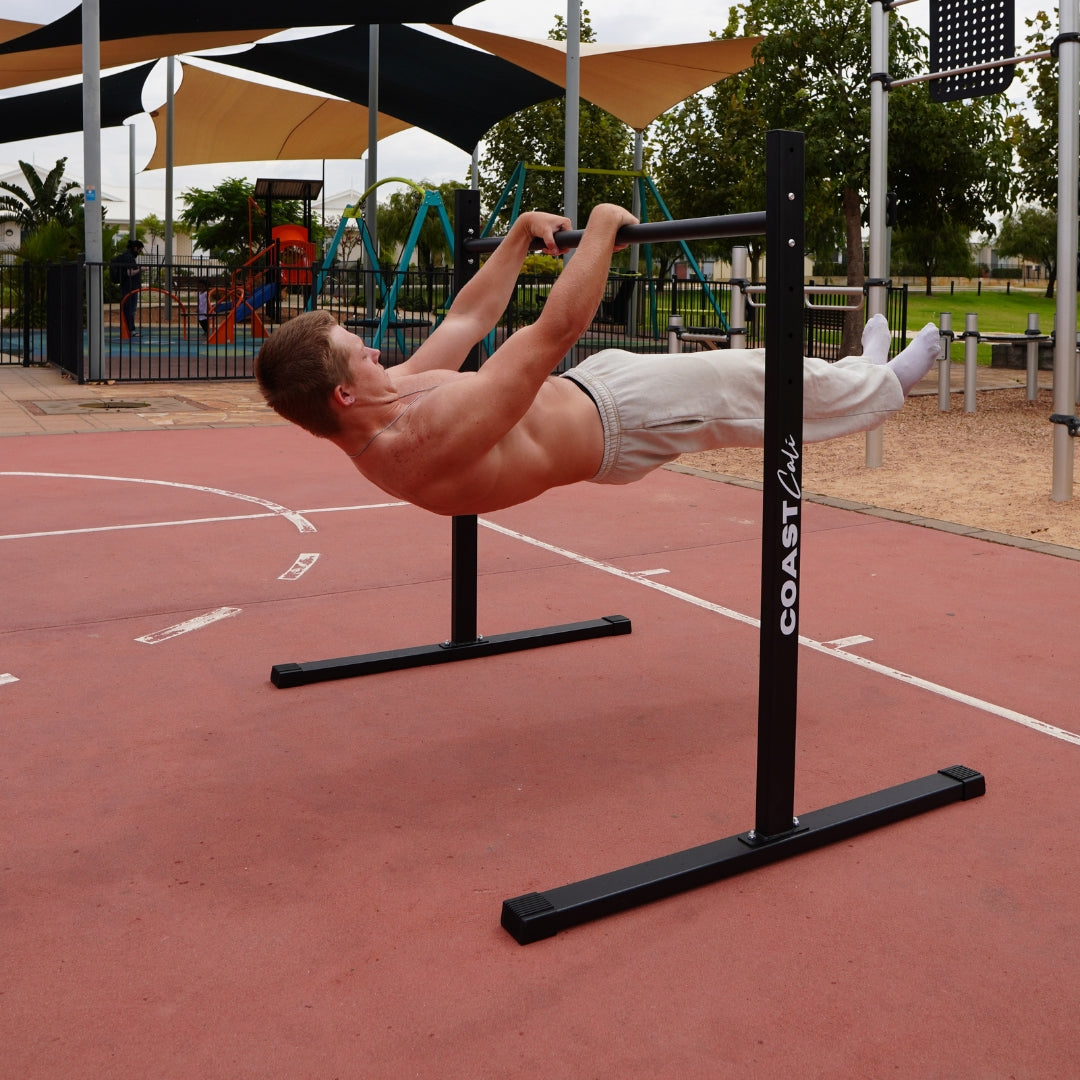 A Person doing a front lever on a calisthenics static bar