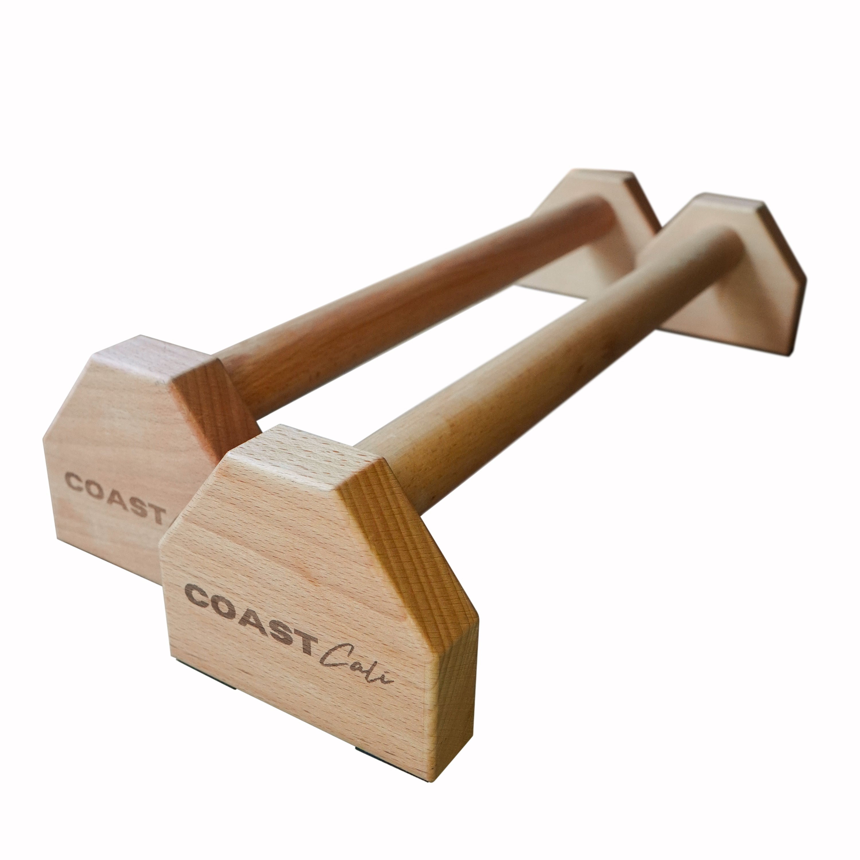 A pair of wooden parallettes with the brand 'COAST CALI' inscribed on the end blocks, designed for handstands and planches.