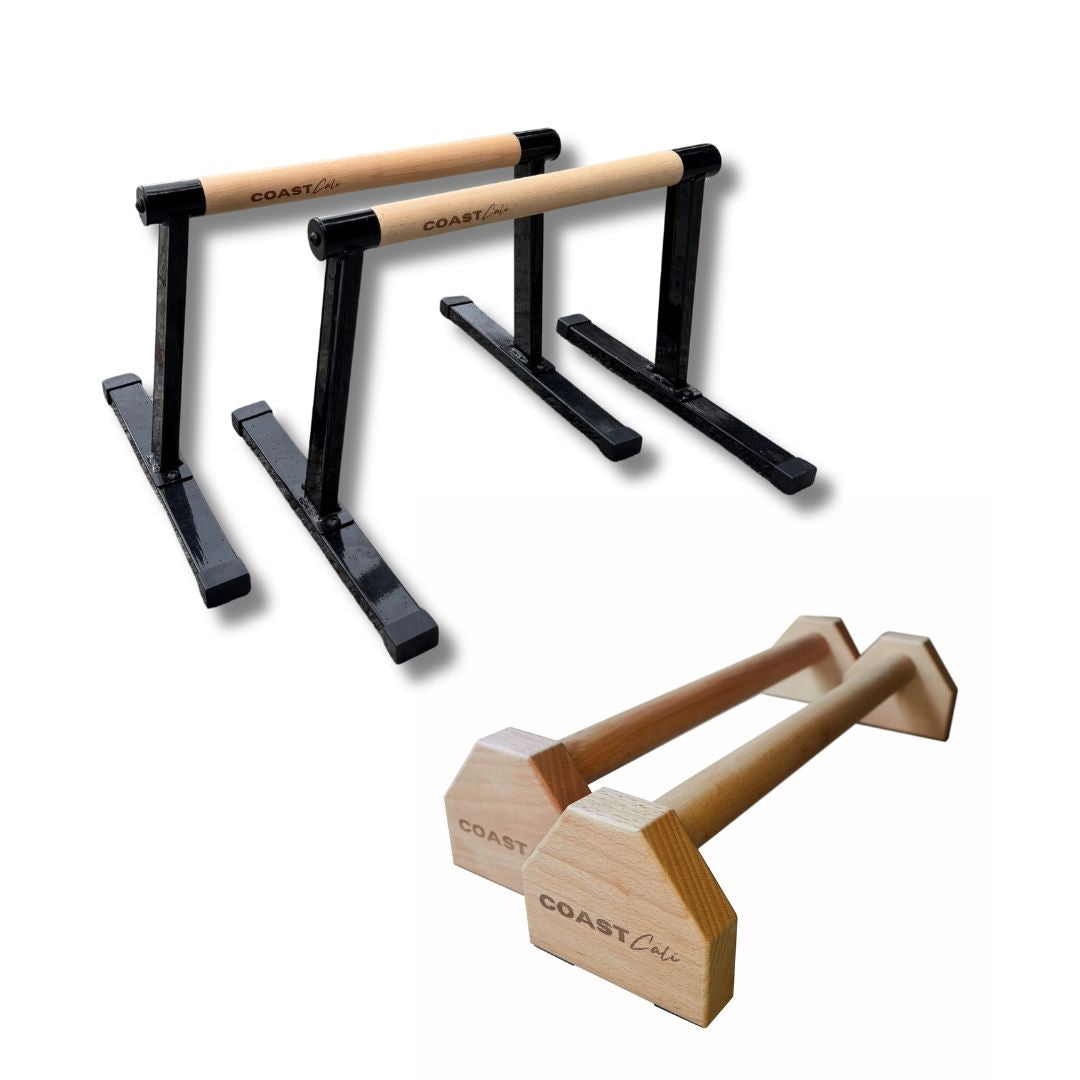 A set of black and wooden parallettes with the brand name 'COAST CALI' visible.