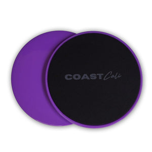 Two purple gymnastics sliders with the logo 'COAST Cali' on the top surface.