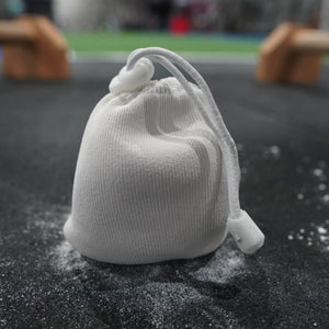 A close up of a chalk ball in a gym