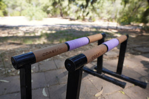 Purple grip tape on premium calisthenics parallettes