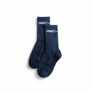 A pair of black socks with the logo 'Coast Cali' on them