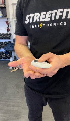 A person applying liquid chalk to their hands