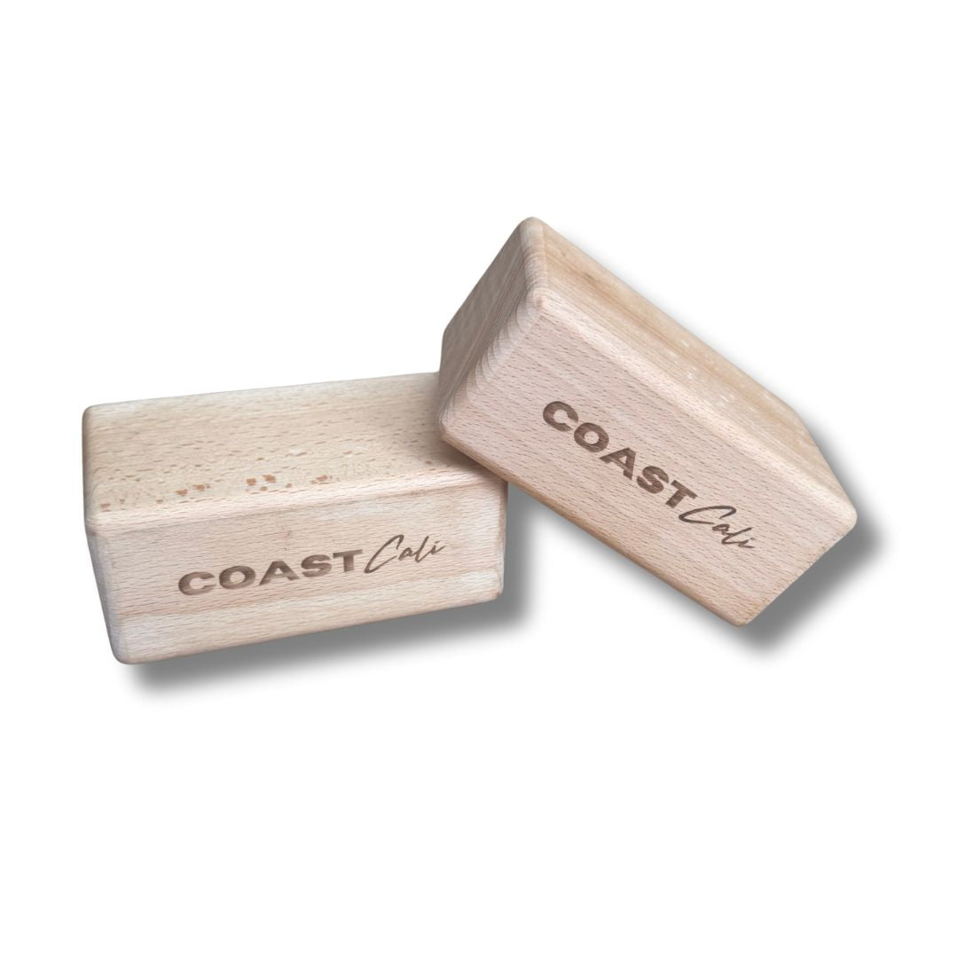 Two wooden blocks with 'COAST Cali' branding on a white background